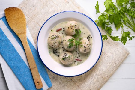 Photo for Fish meatballs with white wine sauce. Traditional tapas from Barcelona, Spain. - Royalty Free Image