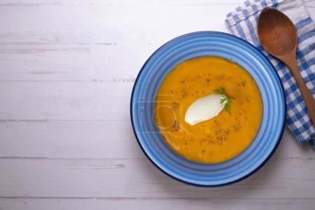 Photo for Carrot and pumpkin cream with cream and nuts. - Royalty Free Image