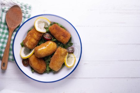 Photo for Fish croquettes. Traditional tapas of the coastal areas in Spain. - Royalty Free Image