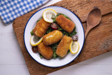 Photo for Fish croquettes. Traditional tapas of the coastal areas in Spain. - Royalty Free Image