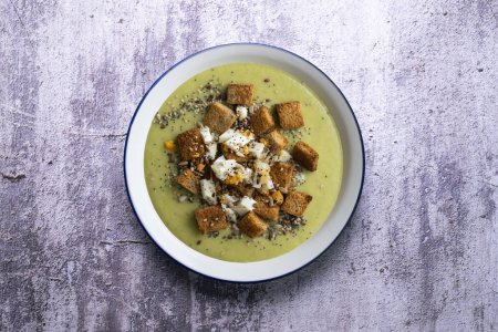 Photo for Artichoke cream with bread croutons. Typical Spanish vegan tapas. - Royalty Free Image
