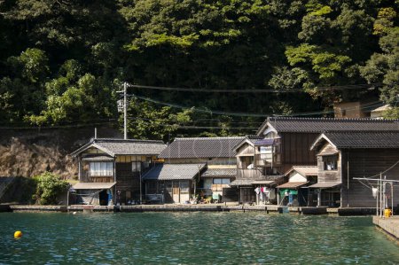 Photo for Beautiful fishing village of Ine in the north of Kyoto. Funaya or boat houses are traditional wooden houses built on the seashore. - Royalty Free Image