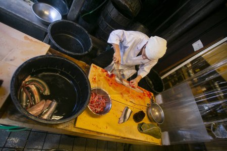 Photo for Narita, Japan; 1st October 2023: Japanese chef preparing and cleaning an eel. Grilled smoked eel is the most traditional food in Narita. - Royalty Free Image