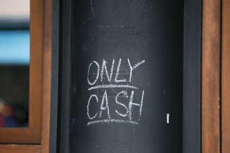 Photo for Tokyo, Japan; 1st October 2023: Only cash written on a black board. - Royalty Free Image