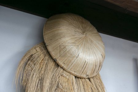 Photo for Japanese sandals, cape and hat handmade from straw from the countryside of the Niigata region in northern Japan. - Royalty Free Image