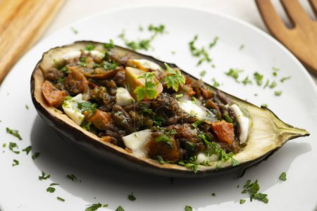 Photo for Eggplant tapa stuffed with beef and mozzarella. Traditional recipe of Spanish gastronomy. - Royalty Free Image