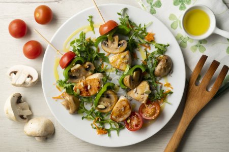 Photo for Organic chicken skewers with mushrooms and salad. - Royalty Free Image