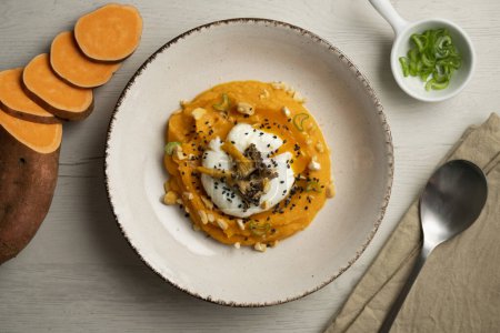 Photo for Sweet potato cream with poached egg and mushrooms. - Royalty Free Image