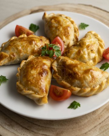 Photo for Baking delicious Argentine empanadas with chicken and vegetables. - Royalty Free Image