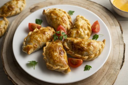 Photo for Baking delicious Argentine empanadas with chicken and vegetables. - Royalty Free Image