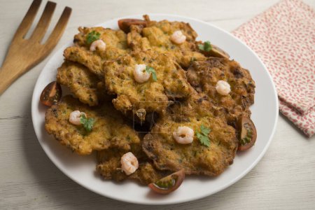 Photo for Tortitas de Camarones. Traditional tapa of flour and egg dough with shrimp or prawns, very famous in the Cadiz area in Spain. - Royalty Free Image