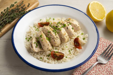 Photo for Chicken cooked with lemon and thyme over rice. - Royalty Free Image