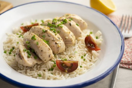 Photo for Chicken cooked with lemon and thyme over rice. - Royalty Free Image