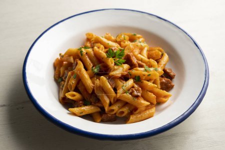 Photo for Macaroni dish with tomato sauce and Spanish chorizo. - Royalty Free Image