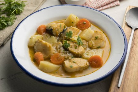 Photo for Hake stew with potatoes and carrots. Traditional Spanish recipe. - Royalty Free Image