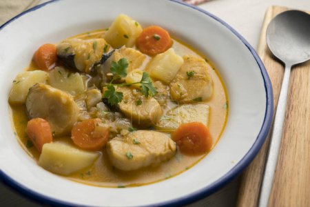 Photo for Hake stew with potatoes and carrots. Traditional Spanish recipe. - Royalty Free Image