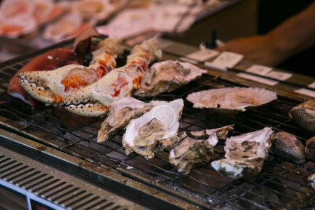Seafood at a food stall at the Tsukiji Outer Market in the city of Tokyo, Japan.