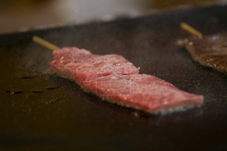Photo for Japanese Kobe Wagyu beef at a food stall at the Tsukiji Outer Market in the city of Tokyo, Japan. - Royalty Free Image
