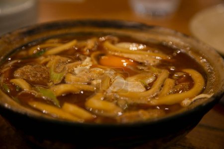 Nagoya famous Miso nikomi udon consists of udon noodles simmered in rich soup made with haccho miso (soybean paste) and bonito stock.