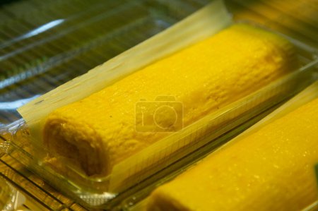 Photo for Tamago  is a Japanese omelet. It's made by rolling together thin layers of fried eggs, then slicing the log into rectangles. - Royalty Free Image