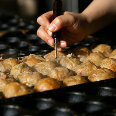 Photo for Authentic Takoyaki balls from Osaka. Takoyaki is a Japanese food made from wheat flour and octopus. - Royalty Free Image