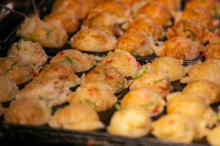 Photo for Authentic Takoyaki balls from Osaka. Takoyaki is a Japanese food made from wheat flour and octopus. - Royalty Free Image