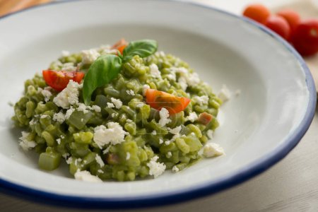 Photo for Creamy Italian risotto with spinach and cheese. Traditional Italian recipe. - Royalty Free Image