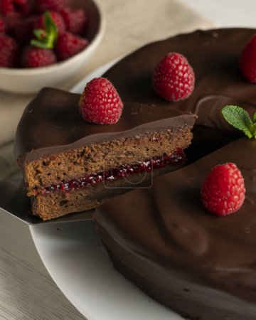 Chocolate Sachertorte with raspberry jam filling.