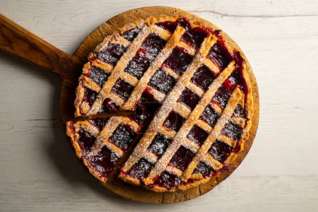 Photo for Traditional Italian crostata filled with raspberry jam. Italian dessert with original recipe. - Royalty Free Image