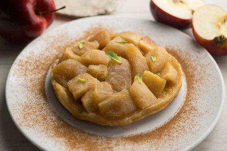 Tarte Tatin is a variant of apple pie in which the apples have been caramelized in butter and sugar before adding the dough.