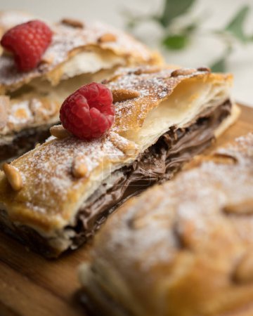 Chocolate San Juan Coca. Traditional San Juan cake to celebrate the arrival of summer in Spain made with puff pastry and cocoa cream.