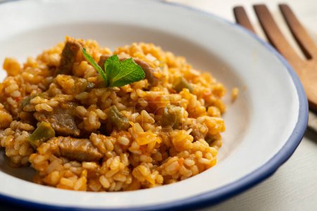 Photo for Spanish rice paella with Iberian pork loin - Royalty Free Image