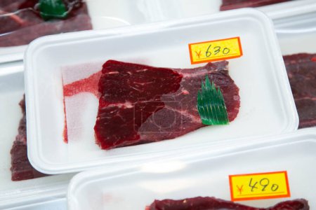 Photo for Cut of whale meat at an Osaka fish market in Japan. - Royalty Free Image