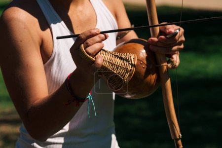 close up view of brazilian musical instrument berimbau on a green grass in nature