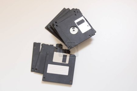 Photo for Floppy diskettes stacked on a white background - Royalty Free Image