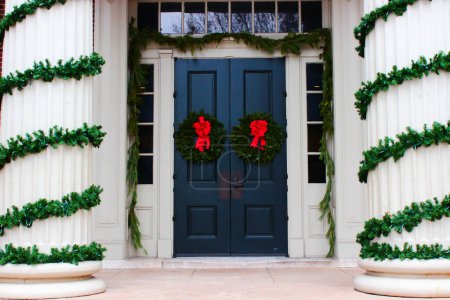 Christmas wreaths on a door and pillars