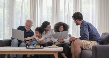 Photo for Diversity caucasian - african family group happy spending time together in cozy living room warmth house on holiday. Selective focus. - Royalty Free Image