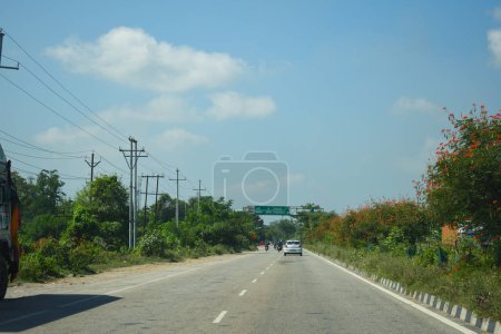 Photo for A Road Direction Board on National Highway 37 of Assam showing distance of places - Royalty Free Image