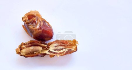 Photo for Tasty dry dates isolated on white background. Kurma, buah kurma, Arabic food. Copy space, negative space, space for text. - Royalty Free Image