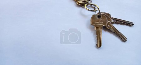 Photo for House keys set on white background  with copy space on the right side. - Royalty Free Image