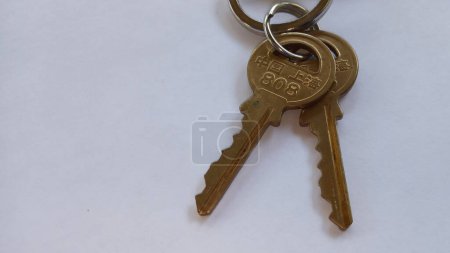 Photo for House keys set on white background with copy  space on the left side. - Royalty Free Image