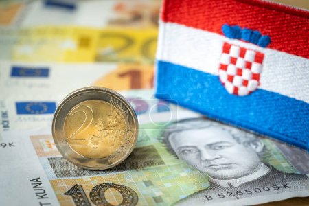 Photo for The flag of Croatia against the background of the common currency of the European Union and the Croatian kuna; The concept of Croatia's accession to the euro zone - Royalty Free Image