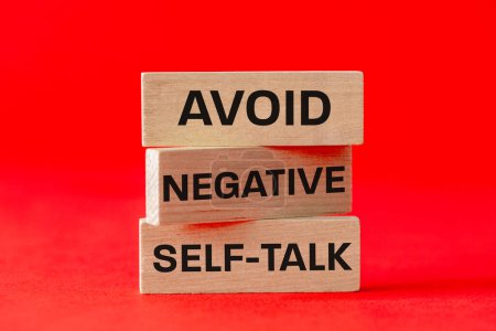 Avoid negative self development symbol, concept text on wooden blocks. Business and avoid negative self development concept