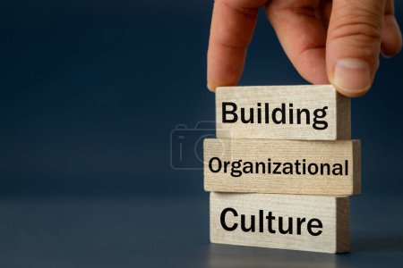 Photo for A wooden block with the words Building, Organizational, Culture, Modern approach to working with people in a team, Creative concept, copy space - Royalty Free Image