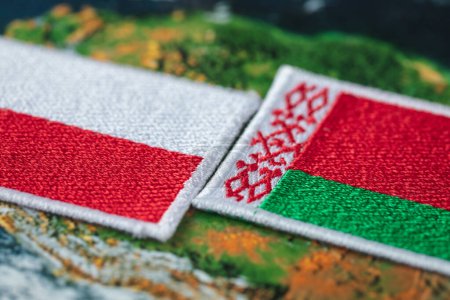 Flags of Poland and Belarus. The concept of mutual relations and border problems of both countries