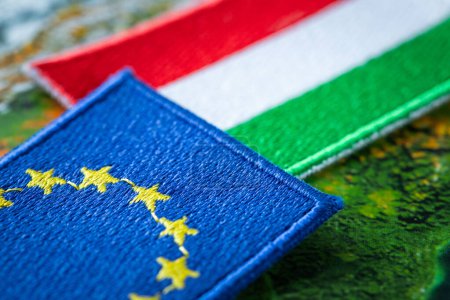Hungary and European Union patches overlapping, Concept of cooperation between EU countries, Flags of Hungary and European Union, close up
