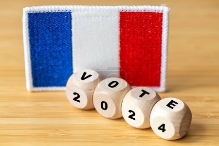 2024 Voting in France. Embroidered symbol of France and cubes with the words Vote and the year 2024
