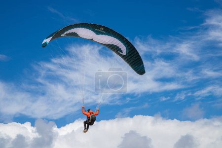 Photo for Paragliding from behind with blue sky. High quality photo - Royalty Free Image