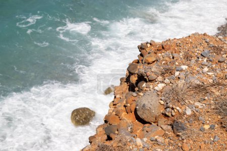 Photo for Sea coast in Crete with stones in the sea and waves. High quality photo - Royalty Free Image