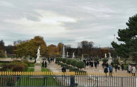 Photo for Paris, France - November 27, 2022: Tourists visiting alley with sculptures at Tuileries Garden in Paris, France - Royalty Free Image